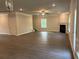 Expansive living room with fireplace, neutral walls, and plenty of natural light at 3382 Milan Ct # 3 Appx/Plan Sqft 3327, Douglasville, GA 30135