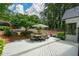 Beautiful backyard with a deck, mature trees, and plenty of space for activities at 700 Broadlands Ln, Powder Springs, GA 30127