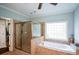 Bathroom with glass enclosed shower and soaking tub at 700 Broadlands Ln, Powder Springs, GA 30127