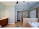 Bathroom with bathtub, glass shower and tile floors at 700 Broadlands Ln, Powder Springs, GA 30127