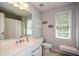 Bathroom featuring a large mirror, vanity, and natural light at 700 Broadlands Ln, Powder Springs, GA 30127