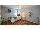 Bedroom with warm wood floors, a ceiling fan and natural light at 700 Broadlands Ln, Powder Springs, GA 30127