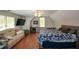 Spacious bedroom with a comfortable couch, TV, mini fridge, and natural light at 700 Broadlands Ln, Powder Springs, GA 30127