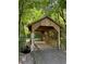 Wood bridge in a forested area, with an asphalt approach at 700 Broadlands Ln, Powder Springs, GA 30127