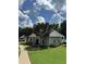 Community clubhouse with a metal roof, well maintained lawn, and a sidewalk at 700 Broadlands Ln, Powder Springs, GA 30127