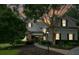 Charming home with stone accents, mature trees, and a beautifully landscaped front yard at 700 Broadlands Ln, Powder Springs, GA 30127