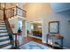 Spacious foyer featuring hardwood floors, staircase, and dining room at 700 Broadlands Ln, Powder Springs, GA 30127