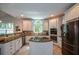 Well-appointed kitchen featuring white cabinets, stainless steel appliances, and center island at 700 Broadlands Ln, Powder Springs, GA 30127