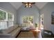Sun-filled living room with vaulted ceilings, hardwood floors and outdoor views at 700 Broadlands Ln, Powder Springs, GA 30127