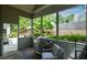 Inviting screened porch with a comfortable chair, grill, and views of the backyard at 700 Broadlands Ln, Powder Springs, GA 30127