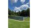 Several community tennis courts with dark green fencing and manicured lawns at 700 Broadlands Ln, Powder Springs, GA 30127
