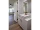 This renovated bathroom features a modern vanity with a stylish vessel sink and gold fixtures at 7144 Carolyn Cir, Lithia Springs, GA 30122
