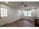 Bedroom with wood floors, a ceiling fan, good natural light, and neutral paint at 7144 Carolyn Cir, Lithia Springs, GA 30122