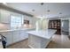 Bright kitchen with island, updated appliances, and a window bringing in light at 7144 Carolyn Cir, Lithia Springs, GA 30122