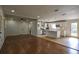 Open-concept living room flowing into kitchen with hardwood floors and abundant natural light at 7144 Carolyn Cir, Lithia Springs, GA 30122