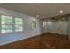 Spacious living room featuring wood floors, modern lighting, and a comfortable atmosphere at 7144 Carolyn Cir, Lithia Springs, GA 30122