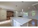 Open concept living room features a large island and great natural light at 7144 Carolyn Cir, Lithia Springs, GA 30122