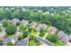 Residential street aerial view featuring mature trees and manicured lawns at 8230 Royal Melbourne Way, Duluth, GA 30097