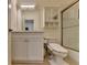 Bathroom featuring a vanity with marble countertops, toilet, and shower with glass door at 8230 Royal Melbourne Way, Duluth, GA 30097
