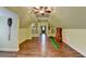 Bonus room with hardwood floors, a ceiling fan, and custom built-in shelving at 8230 Royal Melbourne Way, Duluth, GA 30097