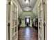 Bonus room with hardwood floors and custom built-in shelving at 8230 Royal Melbourne Way, Duluth, GA 30097