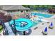 Community pool showcasing a water slide and ample seating for residents at 8230 Royal Melbourne Way, Duluth, GA 30097