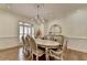 Elegant dining room with a chandelier, large table, and window shutters at 8230 Royal Melbourne Way, Duluth, GA 30097