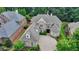 Beautiful brick home featuring manicured landscaping and a circular driveway at 8230 Royal Melbourne Way, Duluth, GA 30097