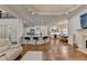 Open living space with hardwood floors and access to kitchen and dining areas at 8230 Royal Melbourne Way, Duluth, GA 30097