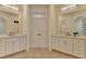 Main bathroom features double vanities with marble countertops at 8230 Royal Melbourne Way, Duluth, GA 30097