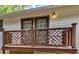 Wooden deck with decorative lattice railing and double doors at 91 Rogers Se St, Atlanta, GA 30317