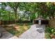 Fenced backyard with a two car garage and gravel area at 91 Rogers Se St, Atlanta, GA 30317