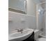 Bright bathroom with a sleek white vanity, tile backsplash, toilet, and a shower/tub combo at 91 Rogers Se St, Atlanta, GA 30317