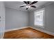 Bedroom with wood floors, a ceiling fan, a window with blinds and neutral walls at 91 Rogers Se St, Atlanta, GA 30317