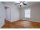 Bedroom with wood floor, a ceiling fan, a closet, and a window with blinds at 91 Rogers Se St, Atlanta, GA 30317