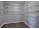 Walk-in closet with gray laminate flooring and wire shelving providing ample storage space at 91 Rogers Se St, Atlanta, GA 30317