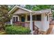 Charming front porch with decorative railing, inviting entrance to this lovely home at 91 Rogers Se St, Atlanta, GA 30317
