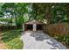 Spacious detached garage with ample parking and storage space, set against a green backdrop at 91 Rogers Se St, Atlanta, GA 30317
