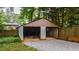 Two car garage featuring concrete block walls and gravel area at 91 Rogers Se St, Atlanta, GA 30317