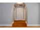 Hallway featuring an arched doorway and hardwood floors, creating a classic and inviting space at 91 Rogers Se St, Atlanta, GA 30317