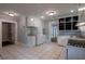 Full view of a kitchen offering white cabinets, stainless steel appliances, and tile flooring at 91 Rogers Se St, Atlanta, GA 30317