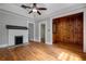 Spacious living room with hardwood floors, fireplace, and view into adjacent rooms at 91 Rogers Se St, Atlanta, GA 30317