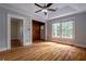 Bright living room showcasing hardwood floors, ceiling fan, and natural light from a window at 91 Rogers Se St, Atlanta, GA 30317