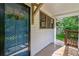 Covered front porch featuring a blue front door and wooden deck at 91 Rogers Se St, Atlanta, GA 30317