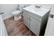 Small bathroom features a modern vanity with a sink and wood look flooring at 1282 Harris Commons Pl, Roswell, GA 30076