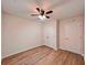 Bedroom featuring hardwood flooring, closet, and ceiling fan at 1282 Harris Commons Pl, Roswell, GA 30076