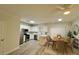 Bright kitchen with stainless steel appliances, center island, and an adjacent dining area at 1282 Harris Commons Pl, Roswell, GA 30076
