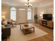 Inviting living room with large windows, modern furnishings, and hardwood floors throughout at 1282 Harris Commons Pl, Roswell, GA 30076