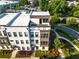 Aerial view of a modern townhome featuring lush landscaping and well-maintained surroundings at 2076 Holtz Ln, Atlanta, GA 30318
