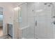 Bright bathroom showcasing a glass-enclosed shower with a built-in bench and modern fixtures at 2076 Holtz Ln, Atlanta, GA 30318